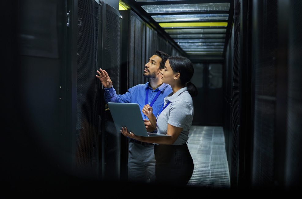Server room, network laptop and people software management, system upgrade and cyber security. Teamwork technician, engineering or programmer staff on computer, information technology or programming.